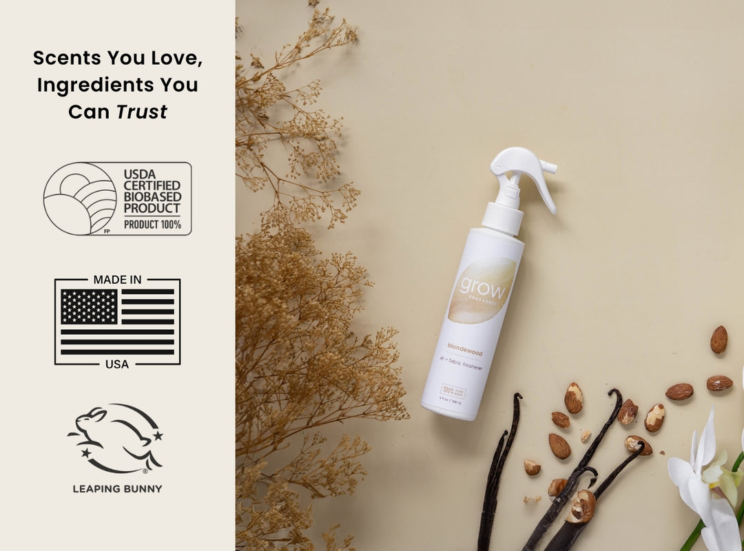 Grow product bottle with vanilla beans and flowers on a beige background, featuring certification logos. Scents You Love, Ingredients You Can Trust / USDA Certified Biobased Product 100% / Made in USA / Leaping Bunny 