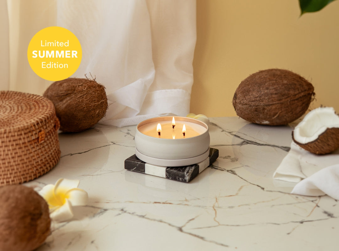 Coconut Soleil 3 Wick Candle with coconuts and a basket on a marble surface, labeled 'Limited Summer Edition'. (featured)
