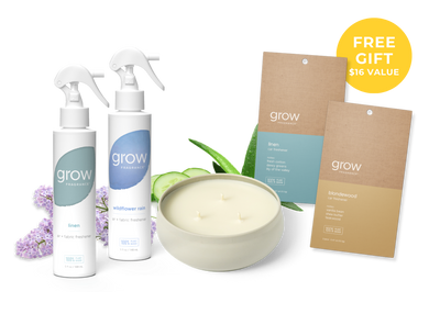 Grow product set with two bottles, a 3 wick candle and packaging on a white background