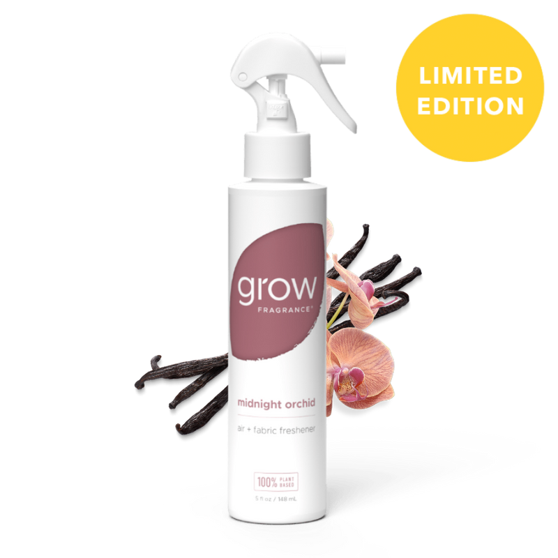 White spray bottle labeled 'grow' with flowers on a white background