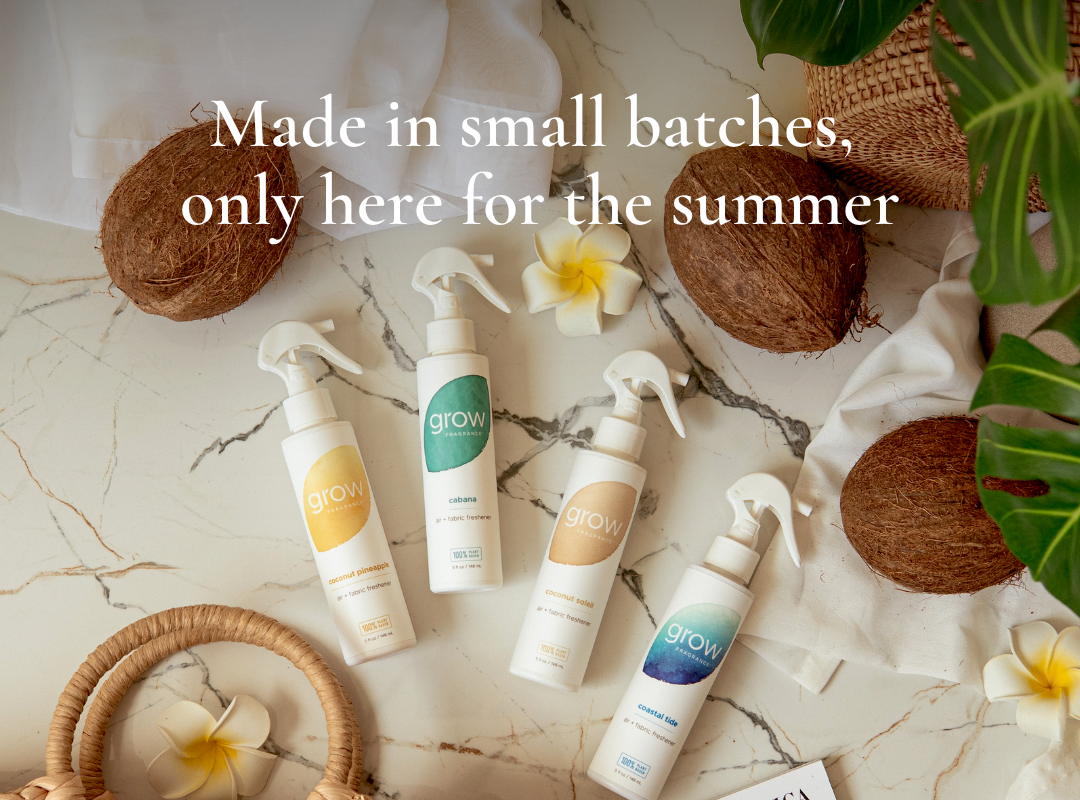 Grow product bottles on a marble surface with coconuts and flowers, text 'Made in small batches, only here for the summer'.