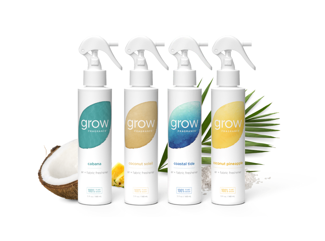 Four 'grow' fragrance bottles with different scents on a white background