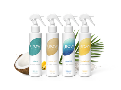 Four 'grow' fragrance bottles with different scents on a white background