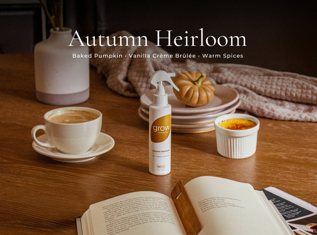 Autumn-themed setting with a cup of coffee, book, and 'grow' bottle on a wooden table.