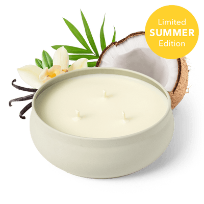 Candle in a white container with coconut, vanilla bean, and flowers on a transparent background