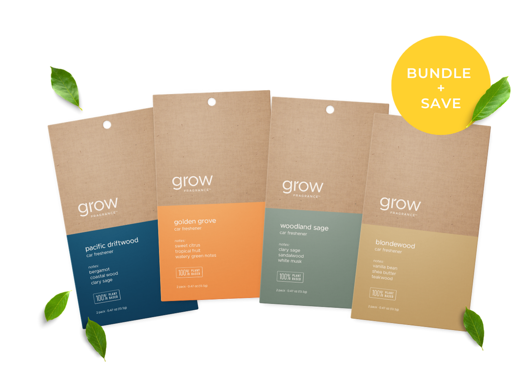 Four 'grow' branded car fresheners product packages with different scents on a white background.