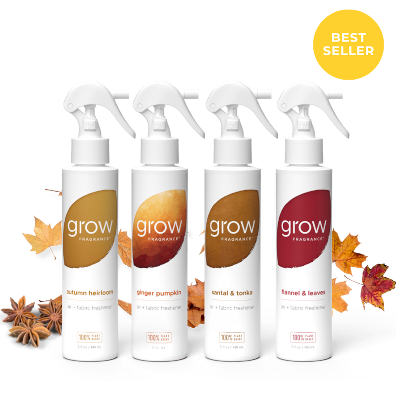 Four white trigger spray bottles of grow Fragrance arranged in a row on a white background with autumn leaves and star anise around them. A yellow circular badge in the top right says BEST SELLER.