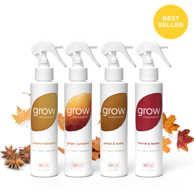Four white trigger spray bottles of grow Fragrance arranged in a row on a white background with autumn leaves and star anise around them. A yellow circular badge in the top right says BEST SELLER.