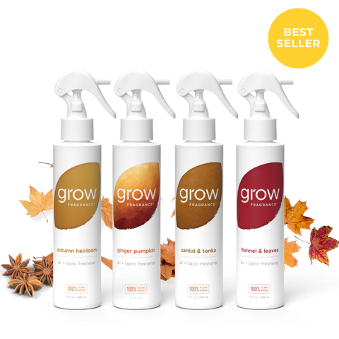 Four white trigger spray bottles of grow Fragrance arranged in a row on a white background with autumn leaves and star anise around them. A yellow circular badge in the top right says BEST SELLER.