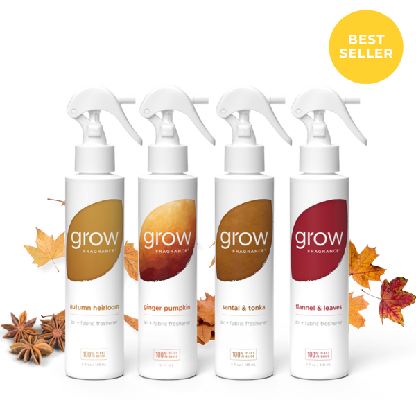 Four white trigger spray bottles of grow Fragrance arranged in a row on a white background with autumn leaves and star anise around them. A yellow circular badge in the top right says BEST SELLER.