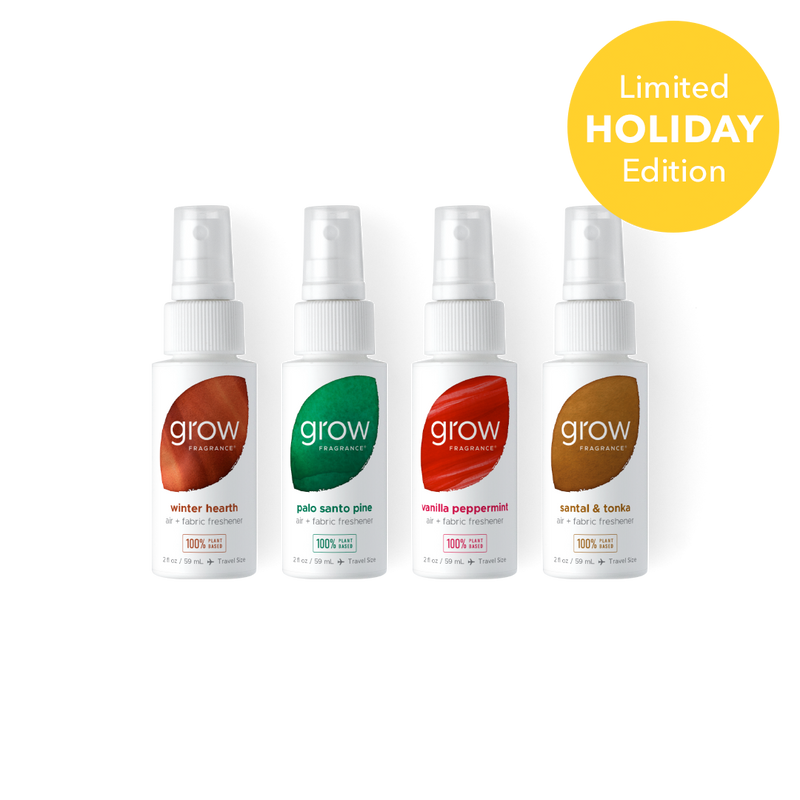 Four small grow fragrance spray bottles arranged in a row on a white background, with a yellow circular badge in the top right that reads 'Limited Holiday Edition.' The bottles have white sprayers and labels with different accent colors: brown, green, red, and brown/gold tones.