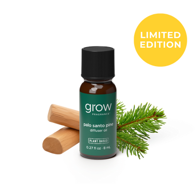 A small amber glass bottle of grow fragrance Palo Santo Pine diffuser oil with a black cap and dark green label, shown on a white background with a wooden diffuser stick, pine needles, and a yellow circle that says LIMITED EDITION.
