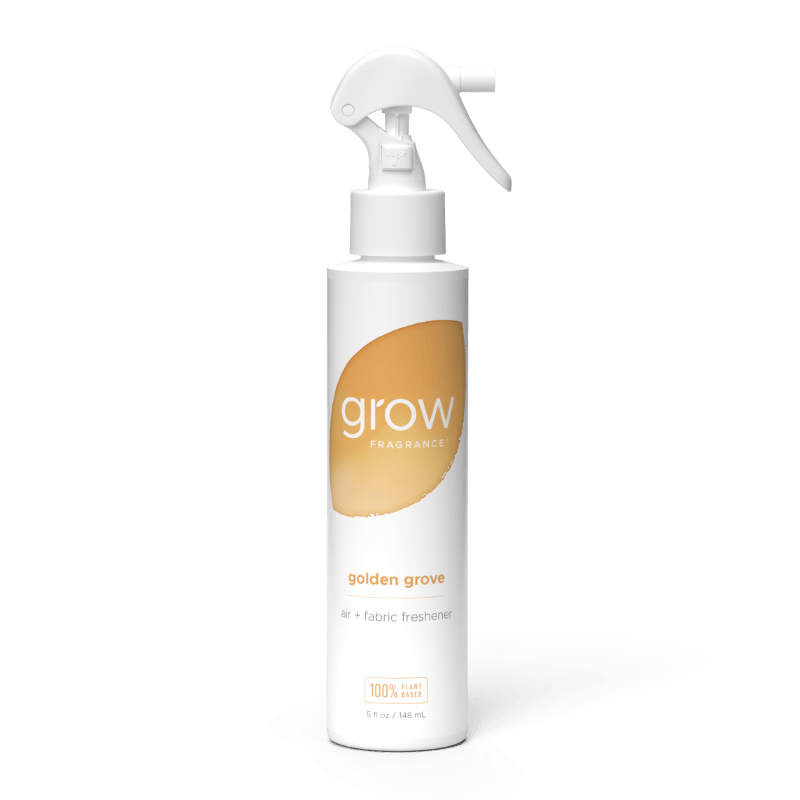 White spray bottle labeled 'grow' and golden grove with a gold label on a white background