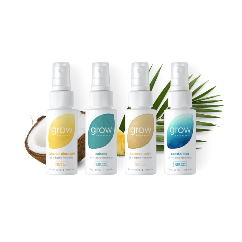 Four 'grow' fragrance bottles with different scents on a white background