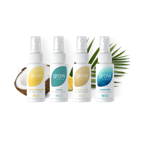 Four 'grow' fragrance bottles with different scents on a white background